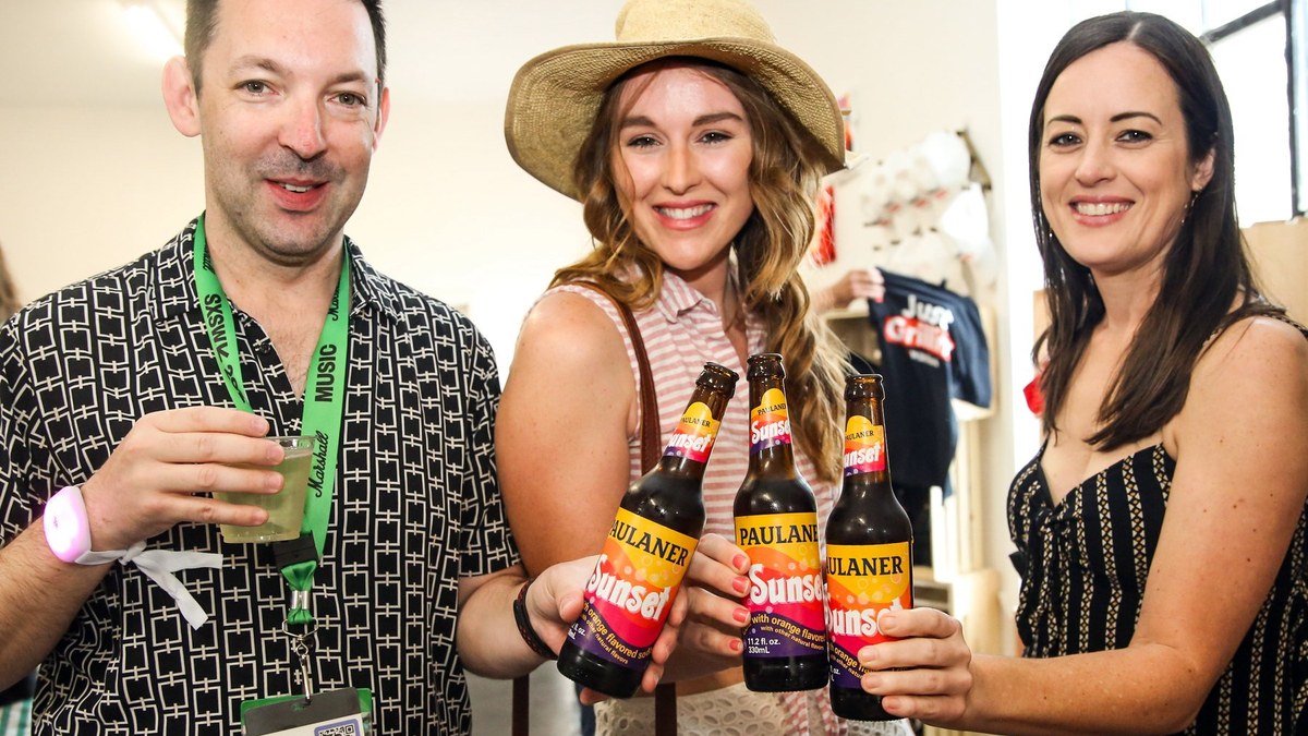 Guests with Sunset Soda bottles inside the Wild Fork Rhythm and Roast room at SXSW 2024, Austin