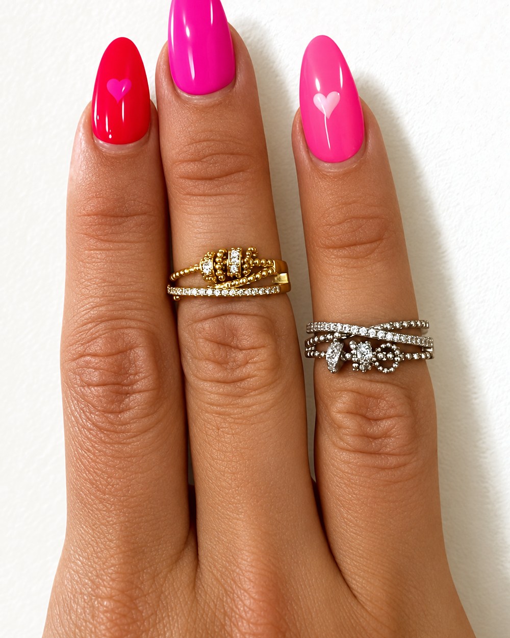 Gold and silver fidget rings worn on two hands, the printed cards behind them