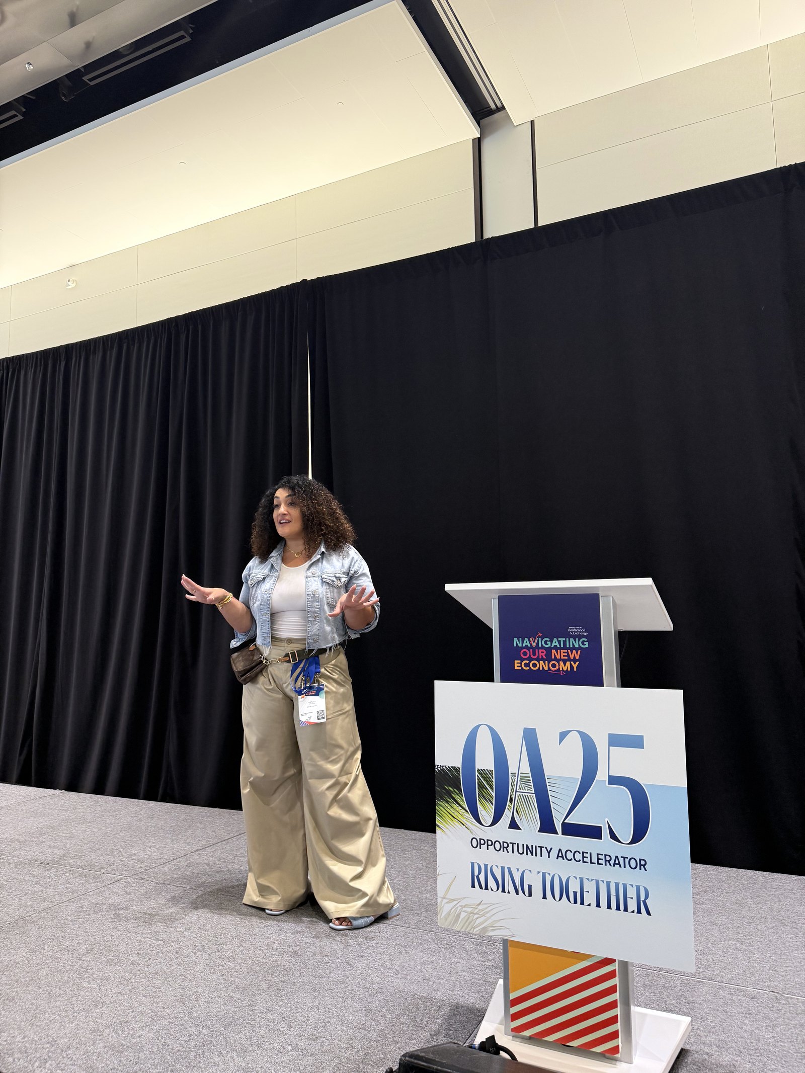Randa Quraan speaking on stage in Miami Beach, November 2025