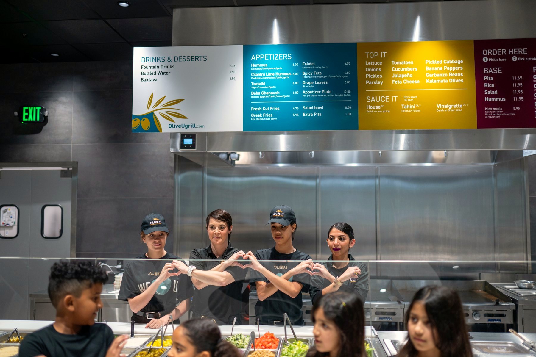 Olive U team behind the counter