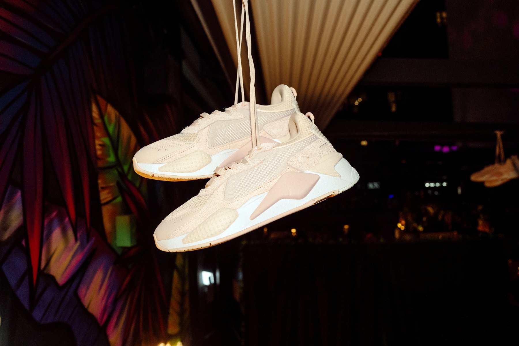 PUMA RS sneakers hanging over the dinner table