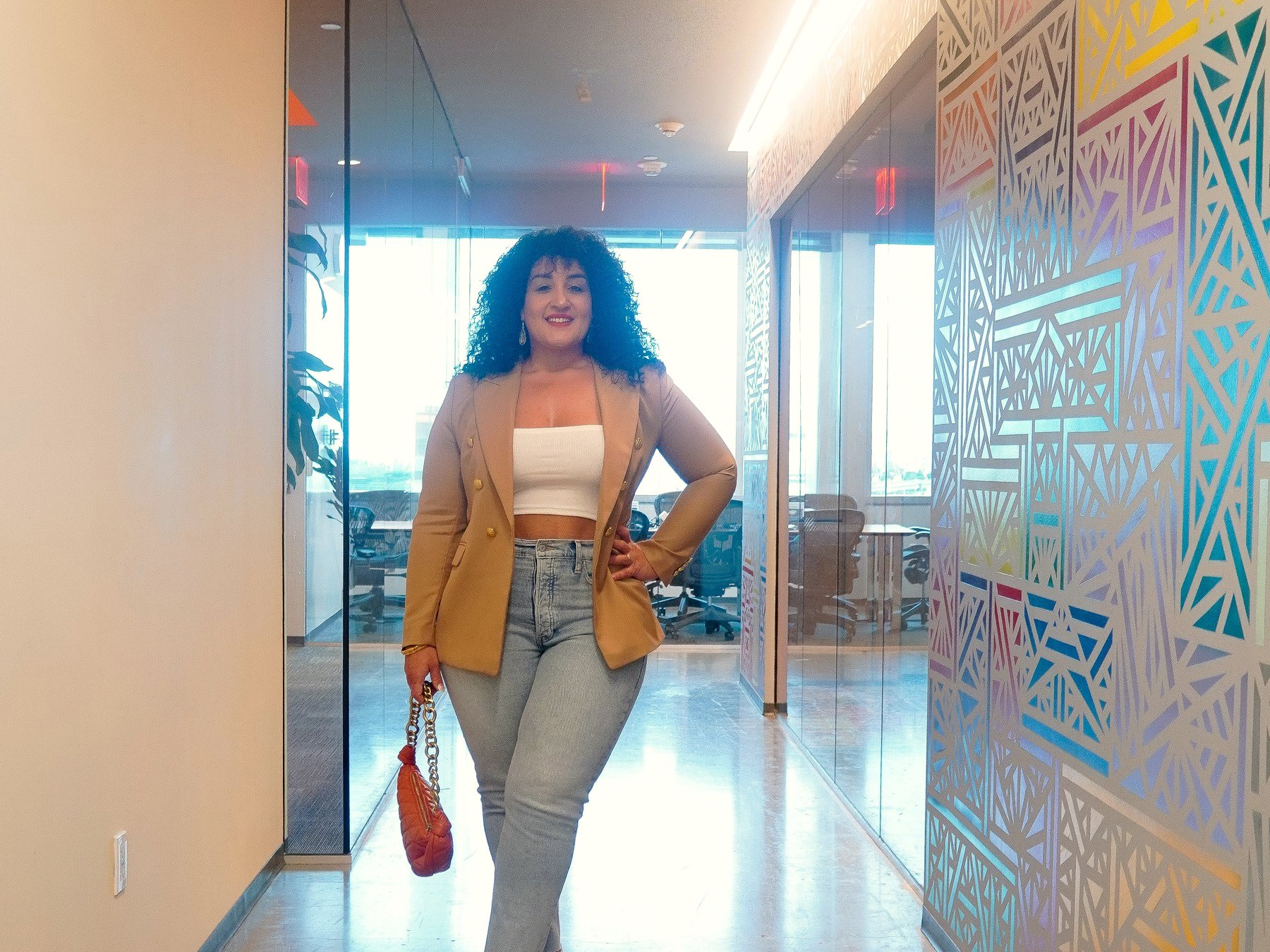 Randa Quraan walking into the office for a strategy session